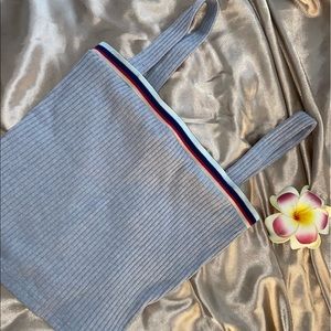 Cropped tank top with rainbow rim.